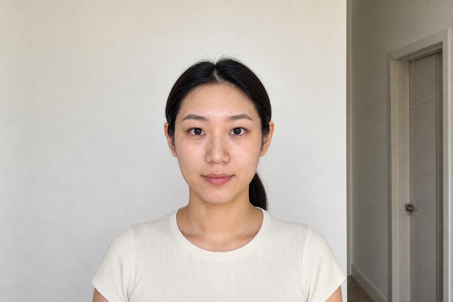 Young woman with a ponytail before processing